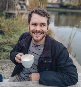 Man outdoors with a Cup of Coffee