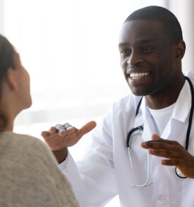 male african american dietician counseling female patient