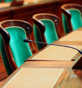 Empty Green Chair in Government Building with microphone