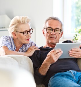 Couple looking at news 