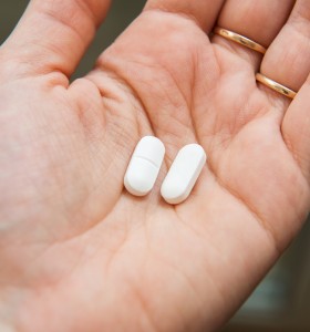 Acetaminophen tablets in hand