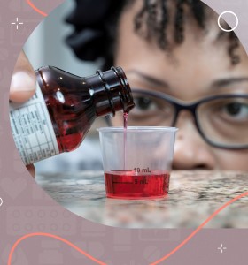 Black woman measuring out liquid medicine with HIH branding