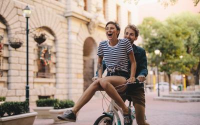 Happy young couple on a bike