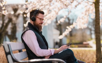 Man Outside Listening to Podcast