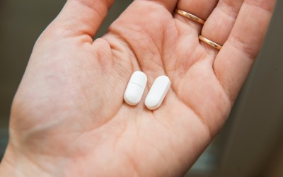 Acetaminophen tablets in hand