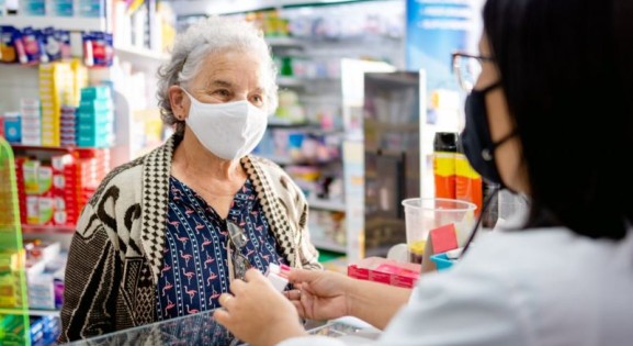 patient at pharmacy counter