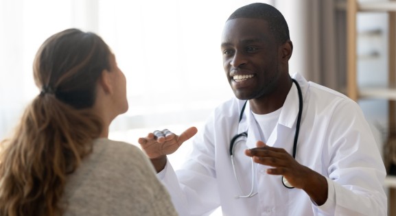 male african american dietician counseling female patient
