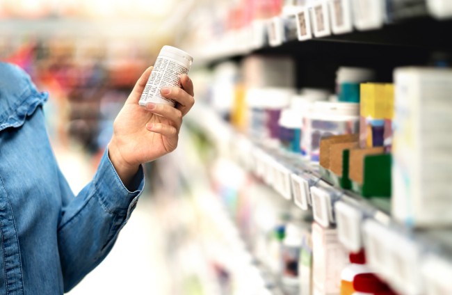 Customer in Store Looking at Label