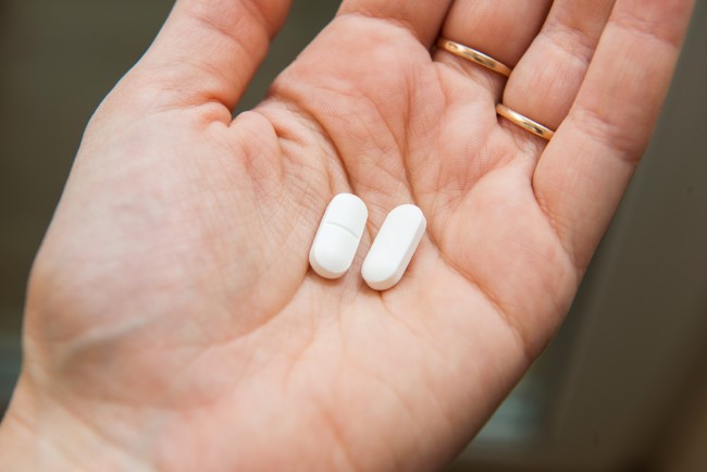 Acetaminophen tablets in hand
